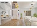 Open dining area features a modern table, chairs, and elegant lighting at 2632 Cathedral Ln, Las Vegas, NV 89108