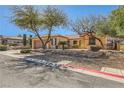 Charming single-story home featuring a well-manicured front yard and attached two car garage at 2783 Cherrydale Falls Dr, Henderson, NV 89052