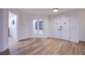 Bright foyer features wood-look floors, white walls, and a double-door entrance at 3057 Downing Pl, Las Vegas, NV 89121