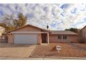 Inviting single-story home featuring a neat front yard and attached two-car garage at 3630 Willow Springs Dr, Las Vegas, NV 89103