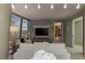 Contemporary living room with a view, featuring modern lighting, neutral tones, and city views at 3722 Las Vegas Blvd # 1712, Las Vegas, NV 89158