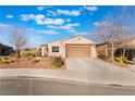 Attractive single-story home with desert landscaping, a spacious driveway, and inviting curb appeal at 4790 Toscana Pl, Pahrump, NV 89061