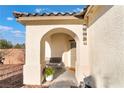 Inviting front porch with bench seating and decorative accents adding charm to the home's entrance at 4790 Toscana Pl, Pahrump, NV 89061