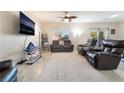 Spacious living room with tile flooring, comfortable seating, and bright natural light at 4790 Toscana Pl, Pahrump, NV 89061