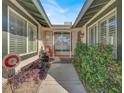 Inviting front porch with tiled walkway, desert landscaping and secure gated entry at 5200 Valley Glen St, Las Vegas, NV 89119