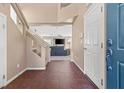 Inviting foyer with tile flooring, a staircase, and a view into the spacious living area at 5971 Sonoma Station Ave, Las Vegas, NV 89139