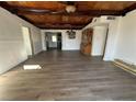 Spacious living room featuring hardwood floors and a wood beam ceiling at 712 Harvard St, Las Vegas, NV 89107