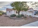 Charming single-story home with stucco exterior, and mature landscaping at 9421 Gold Mountain Dr, Las Vegas, NV 89134