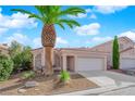 Charming single-story home with a two-car garage and manicured landscape at 104 Hutton Ln, Las Vegas, NV 89145