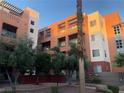 Modern apartment complex featuring balconies, updated paint and desert landscaping at 19 E Agate Ave # 406, Las Vegas, NV 89123