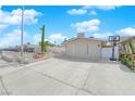 Charming single-story home featuring desert landscaping, a large driveway, and a light-colored exterior at 4301 Fortune Ave, Las Vegas, NV 89107