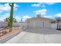 Charming single-story home featuring desert landscaping, a large driveway, and a light-colored exterior at 4301 Fortune Ave, Las Vegas, NV 89107