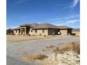 Attractive single-story home with desert landscaping and an asphalt driveway at 4320 Tiger Rd, Pahrump, NV 89048