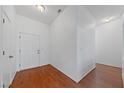 Bright entryway features hardwood floors, a coat closet and neutral paint at 502 Edgefield Ridge Pl, Henderson, NV 89012