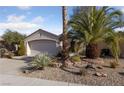 Charming single-story home with a two-car garage and desert landscaping at 502 Edgefield Ridge Pl, Henderson, NV 89012