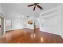 Spacious living room with light, neutral walls and glossy hardwood flooring at 502 Edgefield Ridge Pl, Henderson, NV 89012