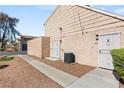 Outdoor view of exterior with access doors and modern A/C unit at 5166 Gray Ln # M, Las Vegas, NV 89119