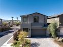 Well-maintained two-story home with a paved driveway and low-maintenance landscaping at 59 Strada Loreto, Henderson, NV 89011