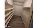 Walk-in closet featuring built-in shelving to maximize space and organization at 615 S Royal Crest Cir # 10, Las Vegas, NV 89169