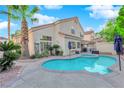 Backyard with a sparkling pool, and covered patio perfect for outdoor entertaining at 7632 Desert Largo Ave, Las Vegas, NV 89128