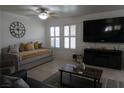 Cozy living area with a sofa, accent pillows, and a large flat-screen TV at , Las Vegas, NV 89118