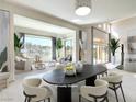 Bright dining room boasts neutral tones and a large window with great outdoor views at 1 Ibis Ct, Henderson, NV 89052