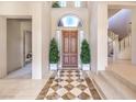 Welcoming foyer boasts a grand entrance with decorative tile flooring and a staircase at 1 Ibis Ct, Henderson, NV 89052