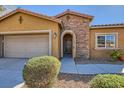 Lovely single-story home with stone accents, desert landscaping, and a two-car garage at 10746 Lightning Sky St, Las Vegas, NV 89179