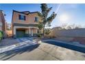 Lovely two-story home with a one-car garage, desert landscaping and a paved driveway at 11103 African Sunset St, Henderson, NV 89052