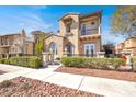 Lovely two-story home boasting a cozy balcony and manicured landscaping for enhanced curb appeal at 11354 Merado Peak Dr, Las Vegas, NV 89135