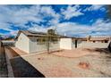 Expansive backyard with patio, rock accents and privacy fence at 1813 Pluto Dr, Las Vegas, NV 89108