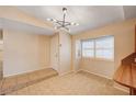 Bright dining room features tile flooring, a modern light fixture, and ample natural light at 1813 Pluto Dr, Las Vegas, NV 89108