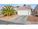 Charming single-story home featuring a two-car garage, mature landscaping, and inviting curb appeal at 1924 Falling Tree Ave, North Las Vegas, NV 89031