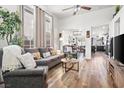 Bright and airy living room with hardwood floors and large windows at 1924 Falling Tree Ave, North Las Vegas, NV 89031