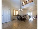 Inviting dining area boasts natural light, tile flooring, and access to the living room at 2681 Benton Cove St, Laughlin, NV 89029
