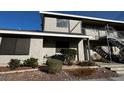 Exterior view of a two-story apartment with well-kept landscaping at 2899 Bluebonnet Dr # 2899, Henderson, NV 89074