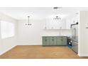 Open-concept kitchen with white cabinetry and stainless steel appliances at 304 Orland St # 43, Las Vegas, NV 89107