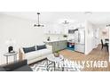 Cozy living room and kitchen area with modern finishes and ample natural light at 304 Orland St # 43, Las Vegas, NV 89107