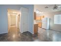 Bright kitchen area with wood cabinets, granite countertops, and a full appliance suite at 3236 Idaho Springs St, North Las Vegas, NV 89032