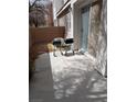 A concrete backyard with two grills and a sliding glass door at 3681 Hidden Beach Ct, Las Vegas, NV 89115