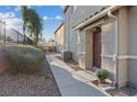 The front entrance of a home is complemented by rock landscaping and a well-maintained walkway at 4305 Morgan Manor St # 3, North Las Vegas, NV 89032