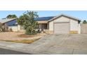 Lovely single-story home featuring a front yard with desert landscaping and a convenient attached garage at 53 Montello Ave, Las Vegas, NV 89110