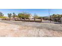 Charming home with a beautiful decorative iron gate and brick perimeter wall at 6094 S Lamb Blvd, Las Vegas, NV 89120