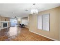 Spacious living room with wood flooring, fireplace, and bright natural light at 8452 Boseck Dr # 110, Las Vegas, NV 89145