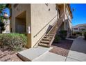 Exterior view of building with stairs and landscaping at 8501 W University Ave # 2020, Las Vegas, NV 89147