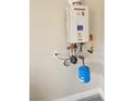Wall-mounted tankless water heater in the house at 10732 Irving Park Ave, Las Vegas, NV 89166