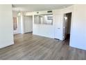 The living room features light-colored wood floors and plenty of natural light at 1150 N Buffalo Dr # 1005, Las Vegas, NV 89128