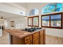 Open-concept kitchen with a large island, gas cooktop, and views to the living area at 2204 Ambermill Ct, Henderson, NV 89052