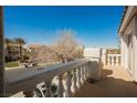 This view from the home's balcony showcases the neighborhood's well-maintained landscaping at 2493 Ram Crossing Way, Henderson, NV 89074