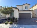Well-maintained two story home with a two car garage and manicured front yard at 2857 Victorian Rd, North Las Vegas, NV 89086